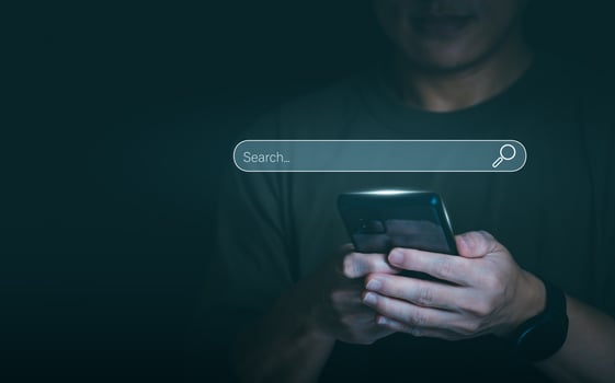 Information search technology, search engine optimization, male hand using a smartphone to search information, using search bar function on your website, Big Data photo