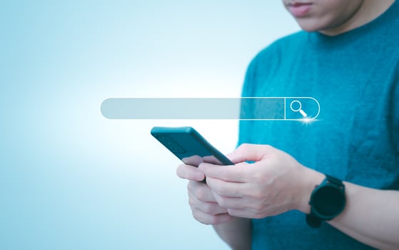 Information search technology, search engine optimization, male hand using a smartphone to search information, using search bar function on your website photo