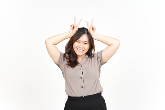 Showing Peace Sign and Smiling Of Beautiful Asian Woman Isolated On White Background photo