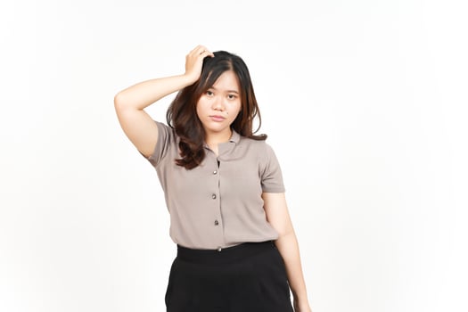 Hand on head with confused gesture Of Beautiful Asian Woman Isolated On White Background photo