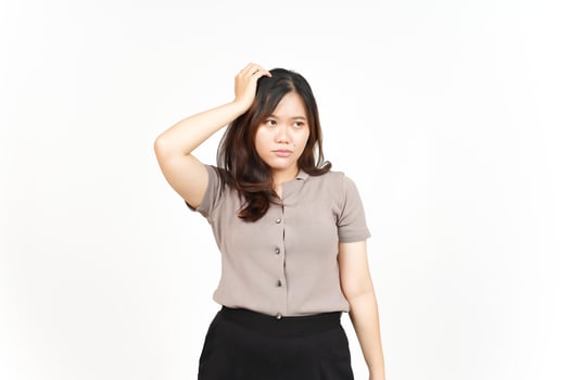 Hand on head with confused gesture Of Beautiful Asian Woman Isolated On White Background photo