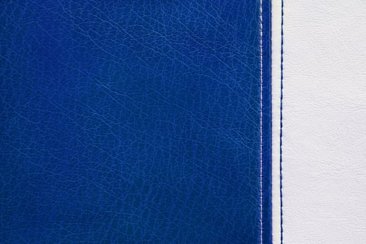Blue and white leather with decorative seam texture background photo