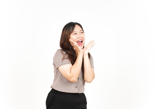 Announcement with hands over mouth Of Beautiful Asian Woman Isolated On White Background photo