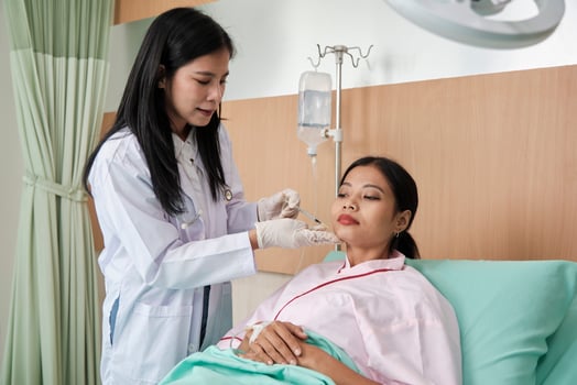 Asian female cosmetic doctor inject Botox into face of woman patient, face care, skin treatment, and young aging with body skincare at beauty clinic hospital, and cosmology medical. photo