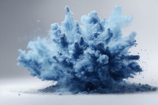 Abstract blue dust explosion on white background. Freeze motion of blue powder splash. Painted Holi in festival.. AI generated photo