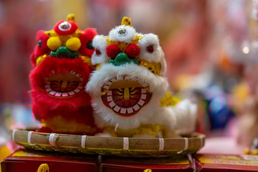 Decorated colorful lanterns hanging on a stand in the streets in Ho Chi Minh City, Vietnam during Mid Autumn Festival. Chinese language in photos mean money and happiness. Selective focus.