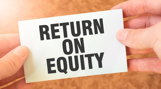 RETURN ON EQUITY. word inscription on white card paper sheet in hands of a businessman. recap concept. red and white paper photo