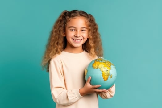 School girl with globe in hands photo