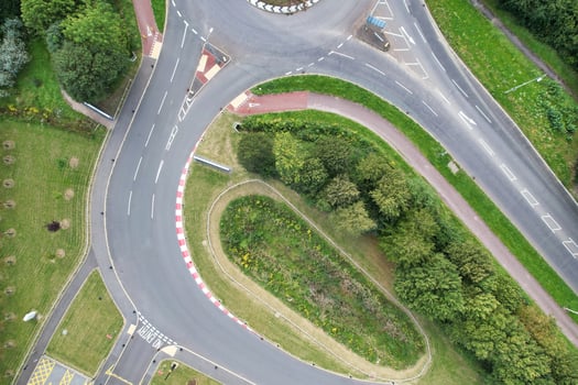 High Angle Footage of British Road and Traffic at Caldecotte Lake of Milton Keynes City of England Great Britain, Beautiful View Captured on August 21st, 2023 with Drone's Camera During Sunny Day photo