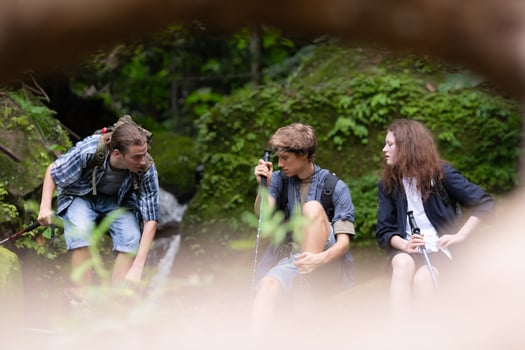 Group of young people hiking in the forest. Travel and adventure concept. photo