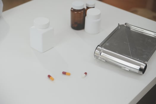 Health care billing statement with stethoscope, bottle of medicine for doctor's work in medical center stone background. photo