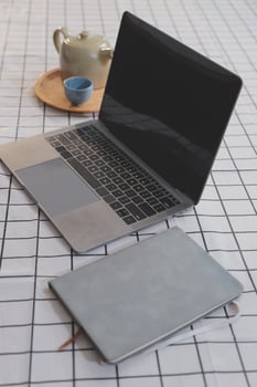 Cropped photo of Freelancer business Asian woman holding coffee cup and at doing planning analyzing the financial report, business plan investment, finance analysis the workplace.