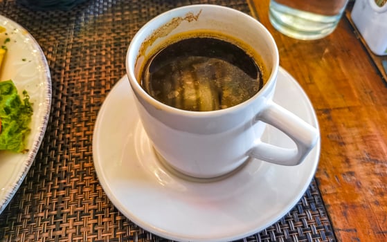 Cup of americano black coffee in restaurant cafe in Mexico. photo