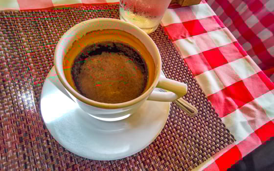 Cup of americano black coffee in restaurant cafe in Mexico. photo