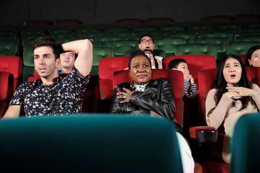 Various people in theater. Multiracial audiences, Black woman, and friends watching dramatic cinema and sad emotional expressions together on movie shows ending, entertainment lifestyle with film. photo
