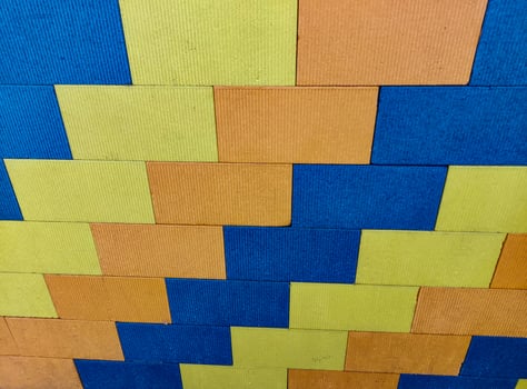 playground wall made with foam blocks,colorful foam flooring for children,a field of multicolored rectangular shapes,background of colored bricks,background, pattern, abstract, texture, design photo
