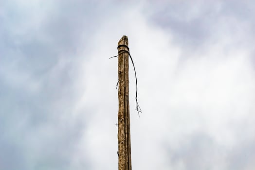 Power electric pole with line wire on colored background close up photo