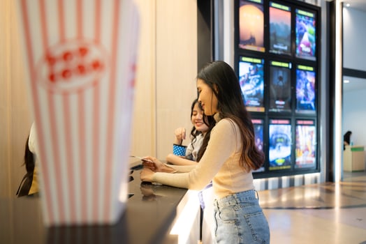 Cinema concept. People watching movie at cinema eating popcorn photo