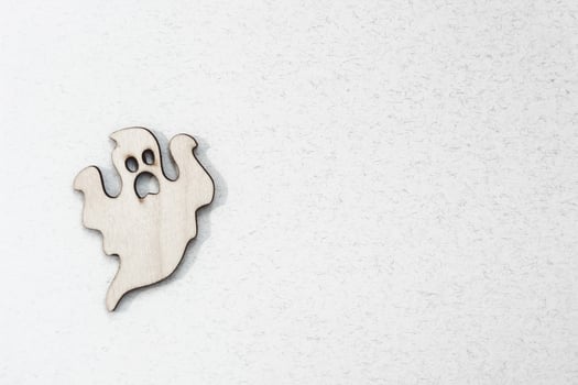 Wooden toy ghost on white background Halloween concept photo
