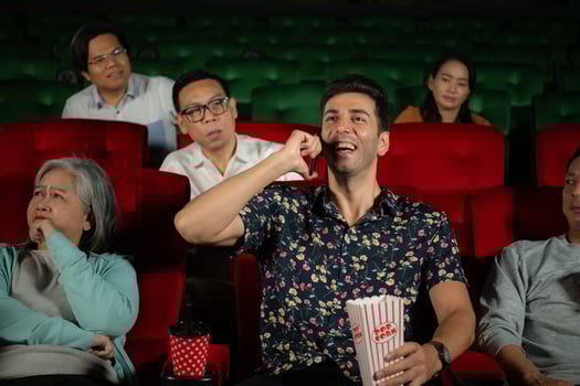 Movie etiquette, Do not talk on the phone while in the cinema, Group recreation and entertainment concept. photo