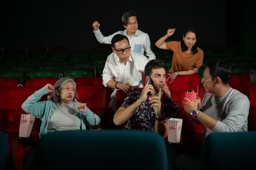 Movie etiquette, Do not talk on the phone while in the cinema, Group recreation and entertainment concept. photo