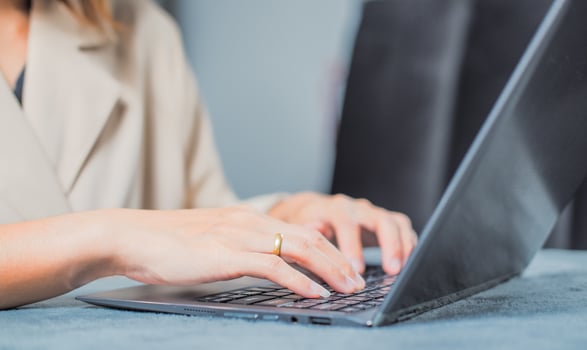 Woman typing work or chatting on laptop Suitable for making infographics. photo