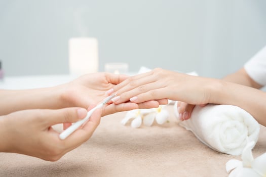 Woman receive care service by professional Beautician Manicure at spa centre. Nail beauty salon use nail file for Glazing treatment. manicurist make nail customer to beautiful. body care spa treatment photo
