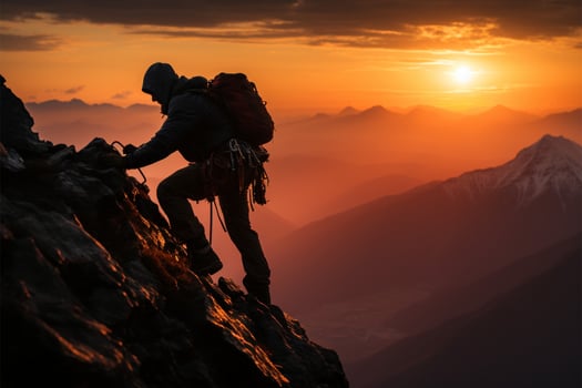 A 30s climber scales a mountain, silhouetted by a stunning sunset AI Generated photo