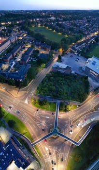 Aerial Vertical Panoramic View of Illuminated Downtown Buildings, Roads and Central Luton City of England UK at Beginning of Clear Weather's Night of September 5th, 2023 photo