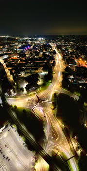 Aerial Vertical Panoramic View of Illuminated Downtown Buildings, Roads and Central Luton City of England UK at Beginning of Clear Weather's Night of September 5th, 2023 photo