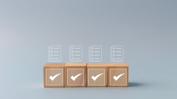 Wooden cubes with check box icon. Assessment, questionnaire, evaluation, online survey online exam choose the right answer in the exam, filling out an online survey form. photo