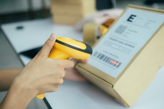 Scanning parcel barcode before shipment. photo