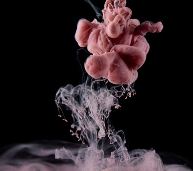 Abstract fluid acrylic painting. Marbled pink abstract Ink cloud on black background. Liquid marble pattern. Modern art. photo