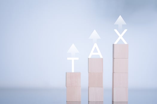 financial research government tax and calculation tax return concept Businessman showing holographic tax on hand Online tax return form filling concept for payment, online marketing, business process. photo