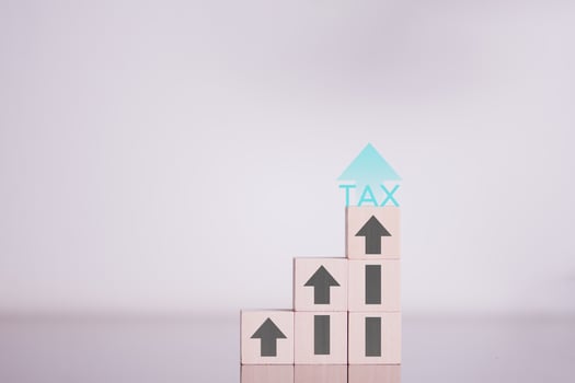 financial research government tax and calculation tax return concept Businessman showing holographic tax on hand Online tax return form filling concept for payment, online marketing, business process. photo