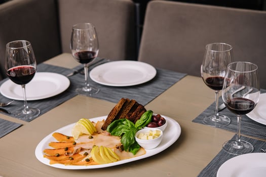 White and red smoked fish slices with glasses of wine photo