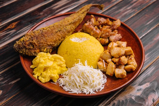 Traditional Moldavian hominy porridge on on a ceramic plate photo