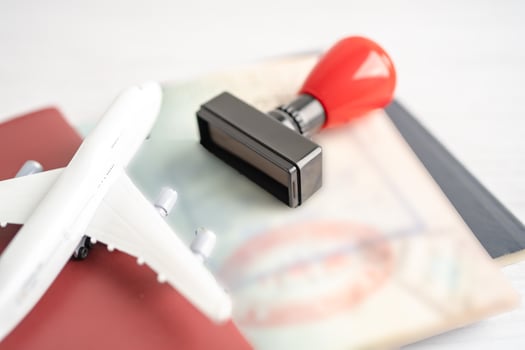 Approved Stamp visa and passport document to immigration at airport in country. photo