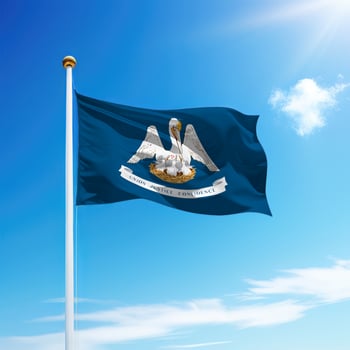 Waving flag of Louisiana is a state of United States on flagpole photo