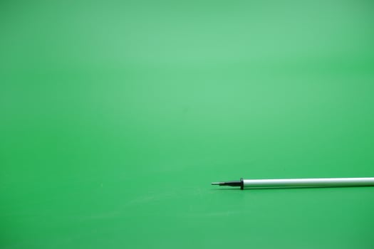 pen refill isolated green background photo