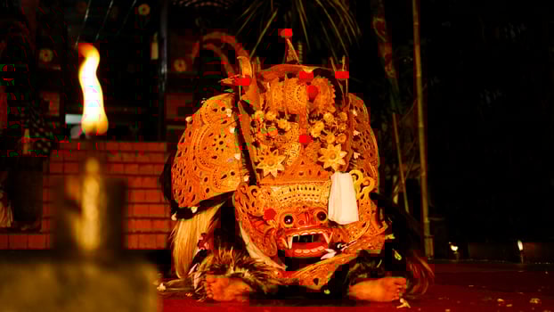 Barong dance staged to celebrate Saraswati's feast day, night day. Balinese dance and dancer, spooky photo