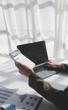 Financial Business woman analyze the graph of the company's performance to create profits and growth, Market research reports and income statistics, data,repotr,Financial and Accounting concept. photo