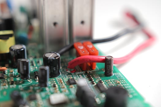 Power Supply modern printed-circuit board with electronic components with transistor. PCB detail photo