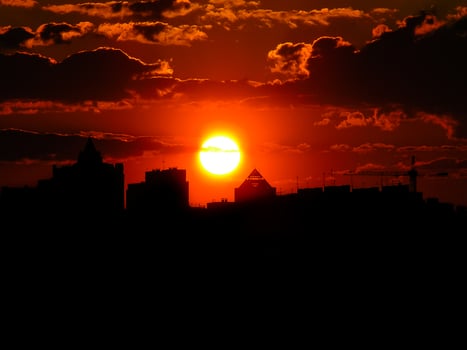 Autumn red sunset with a purple sky photo