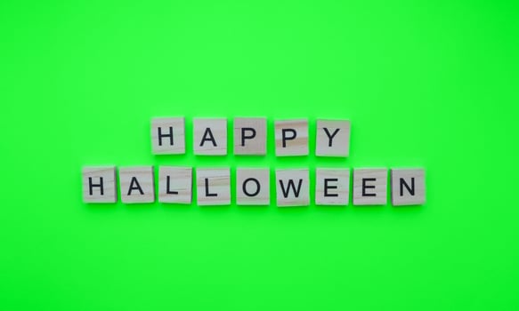 October 31, happy Halloween, minimalistic banner with the inscription in wooden letters photo