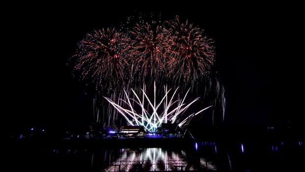 fireworks over the temple in the dark sky photo