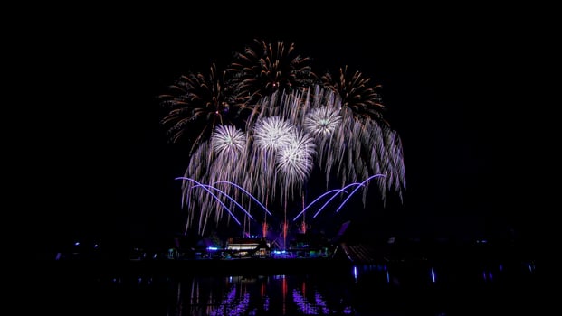 fireworks over the temple in the dark sky photo
