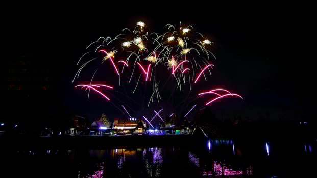 fireworks over the temple in the dark sky photo