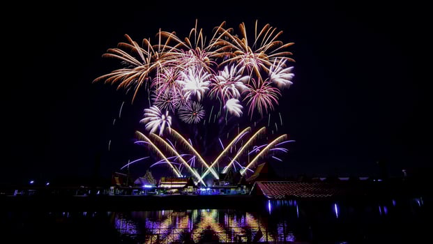 fireworks over the temple in the dark sky photo