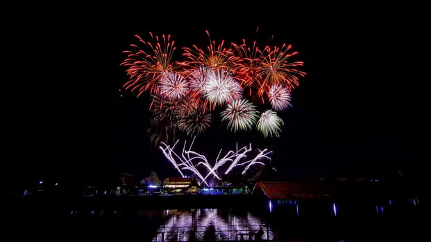 fireworks over the temple in the dark sky photo
